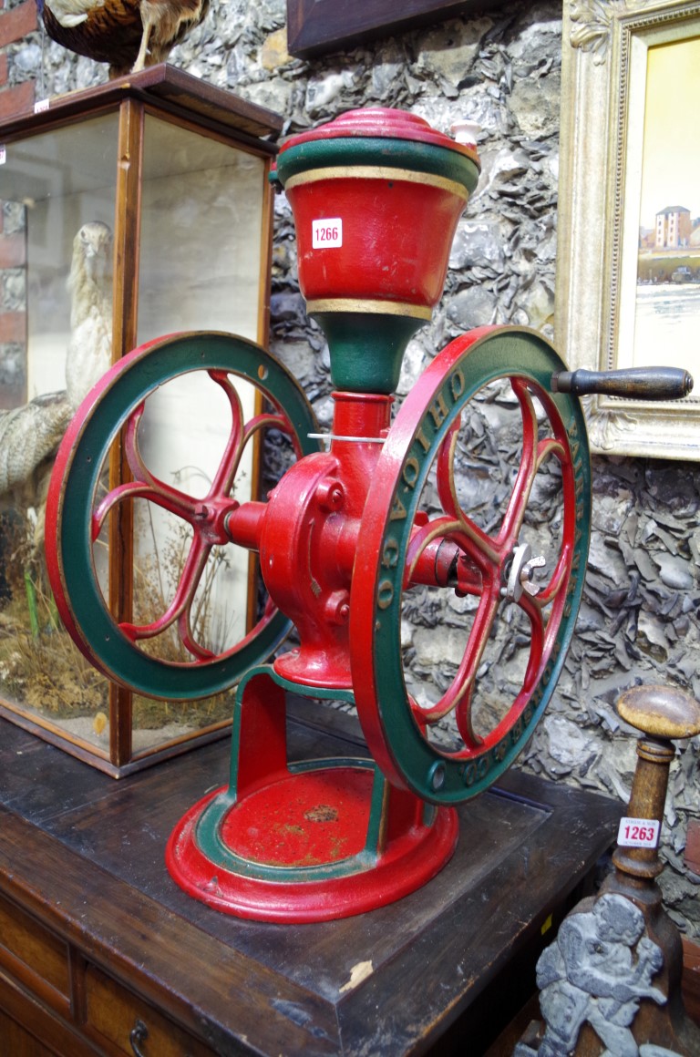 A late 19th century red and green painted cast iron coffee grinder, by Fairbanks Morse & Co.,