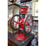 A late 19th century red and green painted cast iron coffee grinder, by Fairbanks Morse & Co.,