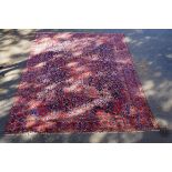 A fine and extremely large Bakhtiari carpet, having three central floral medallions on a floral