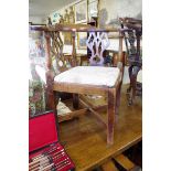 A George III mahogany corner chair.