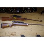 Two old air rifles.