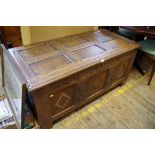 A late 17th century carved oak coffer, 130cm wide.