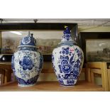 Two large Dutch Delft blue and white vases and covers, largest 41.5cm high.