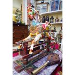 An unusual polychrome painted carousel style rocking horse.