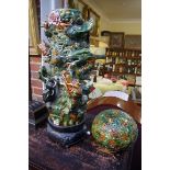 A large Chinese sancai glazed table lamp and shade, decorated in relief with dragons, approx 80cm