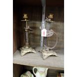 A pair of novelty sword grip candlesticks, 25cm high.