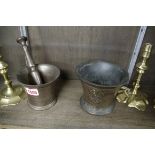 Two old cast metal mortars, one with pestle, largest 11cm high.