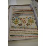 A Georgian needlework sampler, decorated with a panel of rabbits among flowering branches, within