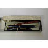 Two vintage Parker fountain pens, each with 14k nib, one boxed; together with a Waterman 512V