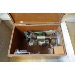 An Olympus binocular microscope, cased and with instructions.