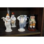 Three Royal Doulton Snowmen Collection figures; together with a similar mug; and a Royal Doulton '