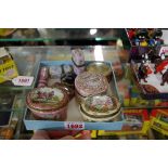 A small collection of antique enamel boxes; together with two agate examples; and a painted ivory