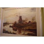 Edgar Freyberg, a riverside windmill, signed, oil on canvas, 59.5 x 80cm.