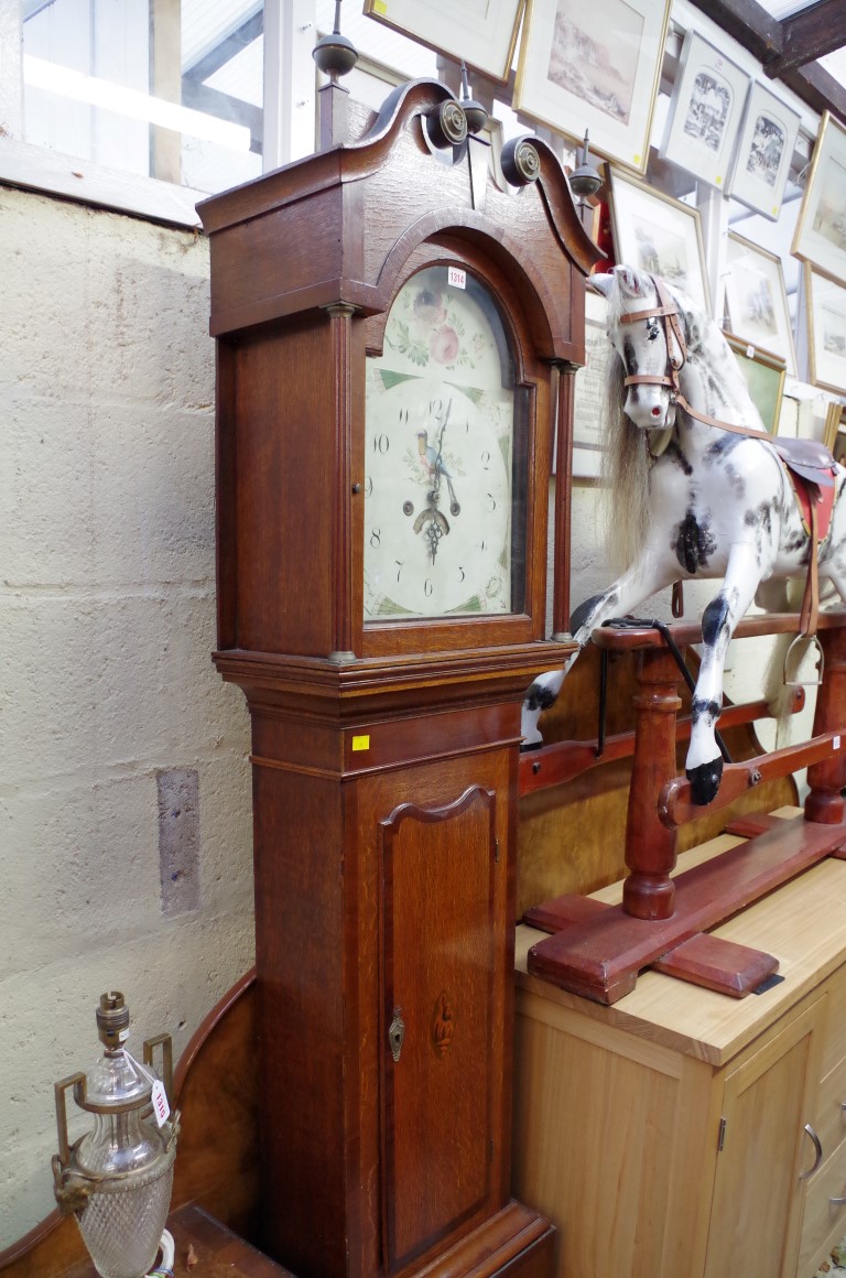 A 19th century oak and mahogany crossbanded 30 hour longcase clock, with 12in arched dial, 211cm
