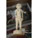 Ethnographica: an ivory figure of a lady, 16cm high.