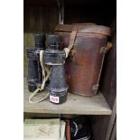 A pair of World War II Ross Bino Prism No.5 Mark II X7 binoculars, in tan leather case.