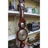 A 19th century mahogany and line inlaid five dial banjo barometer.
