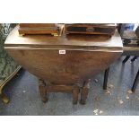 An old oak gateleg table, 66cm wide.