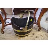 An antique coopered oak and brass bucket, height including handle 42cm.