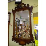 An antique mahogany, parcel gilt and inlaid fret framed wall mirror, 91.5 x 50cm.