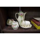 A Clarice Cliff part coffee set, (s.d.).