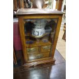 An early 20th century oak smoker's cabinet, 43cm high.