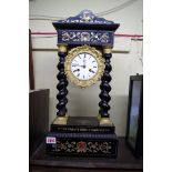 A 19th century ebonized, brass and tortoiseshell inlaid portico clock, 50cm high.