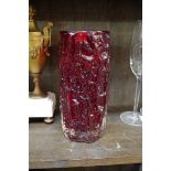 A Whitefriars ruby red 'Bark' pattern glass vase, 23cm high.