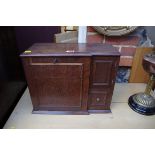 An unusual early 20th century combined stationery and smoker's cabinet, 42cm wide.