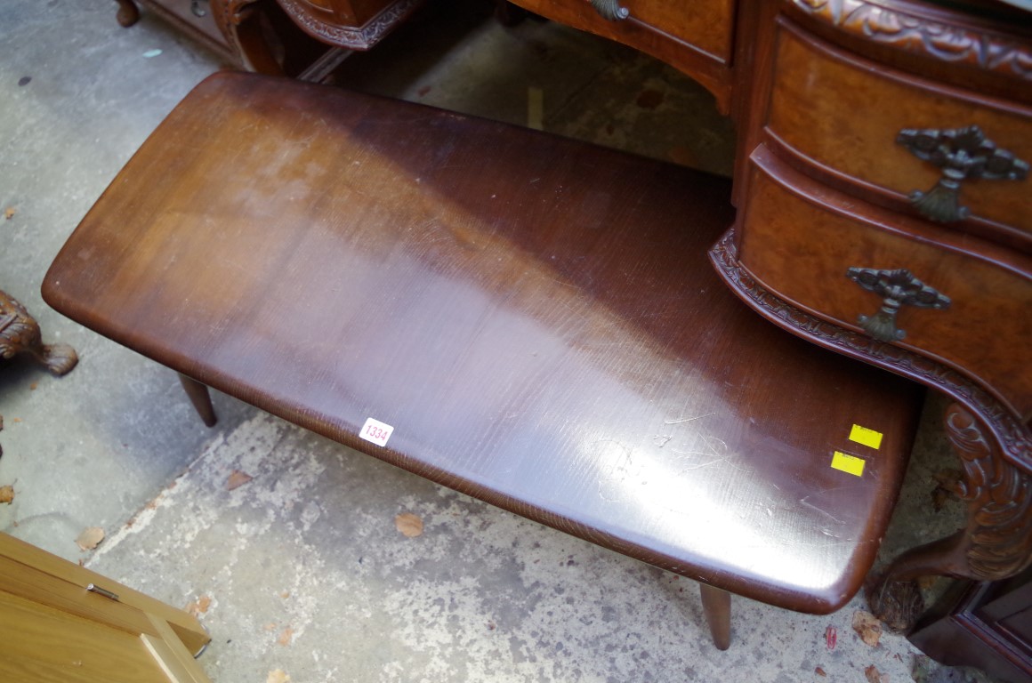 An Ercol dark wood low occassional table, 104cm wide. - Image 2 of 2