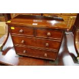 An antique mahogany miniature chest of drawers, 42cm wide.