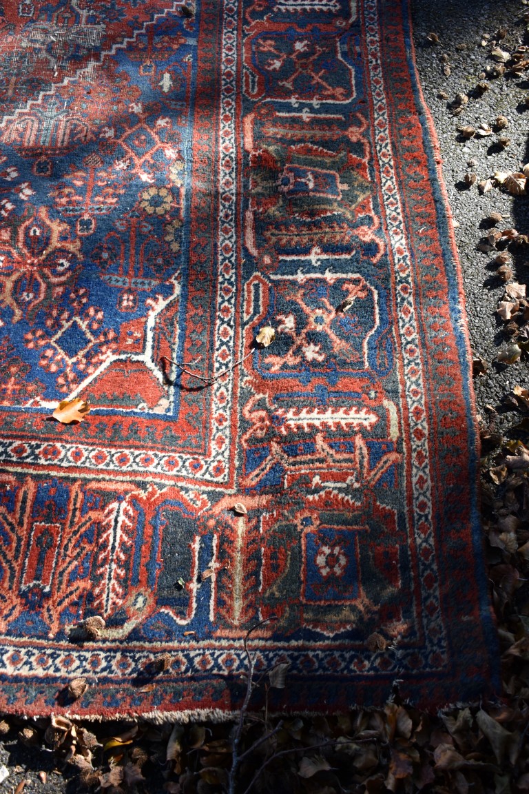 A large Persian rug, having central diamond medallion with allover floral central field, with - Image 4 of 5