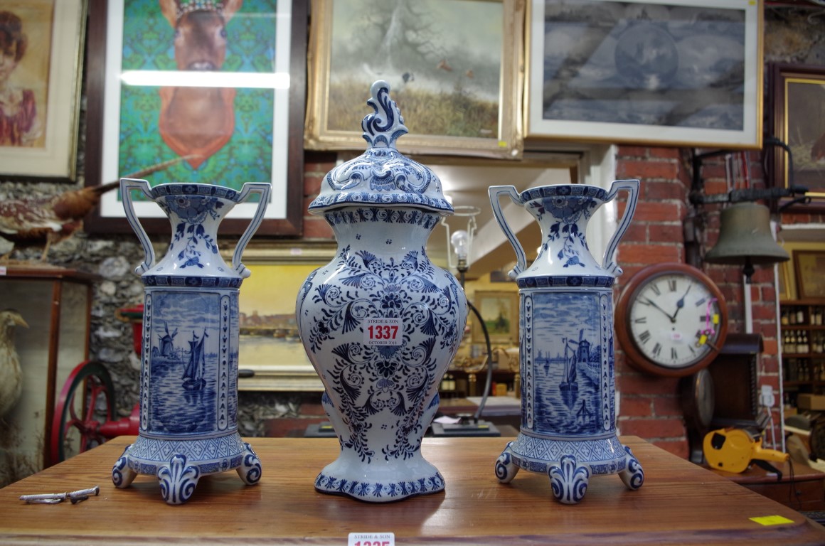 Three Dutch Delft blue and white vases, largest 37cm high.