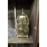 A small brass lantern style clock by Smiths, 25cm high.
