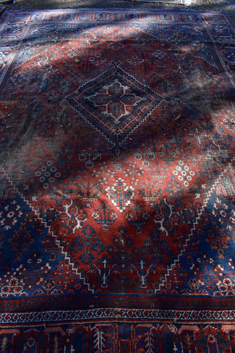 A large Persian rug, having central diamond medallion with allover floral central field, with - Image 3 of 5