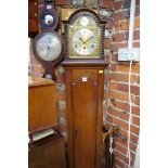 A 1920s oak musical mantel clock, on longcase stand, total height 173cm.