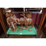 An Eastern carved hardwood elephant and howdah figure group, on plinth base, 59cm wide.