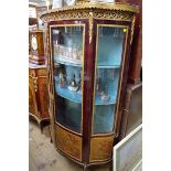A reproduction Louis XV style vitrine, with gilt brass mounts, 101cm wide.