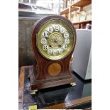 A circa 1900 mahogany and inlaid balloon mantel clock, 29cm high, with pendulum.