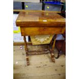 A Victorian walnut combined work and games table, with foldover top revealing inlaid playing