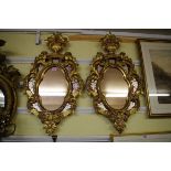 A pair of Venetian style giltwood frame pier mirrors, 82 x 44cm.