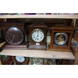 A collection of clocks and timepieces. (two shelves)