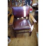 A set of six oak and studded faux leather dining chairs, to include a pair of elbow chairs.