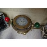 A brass cased nautical compass.