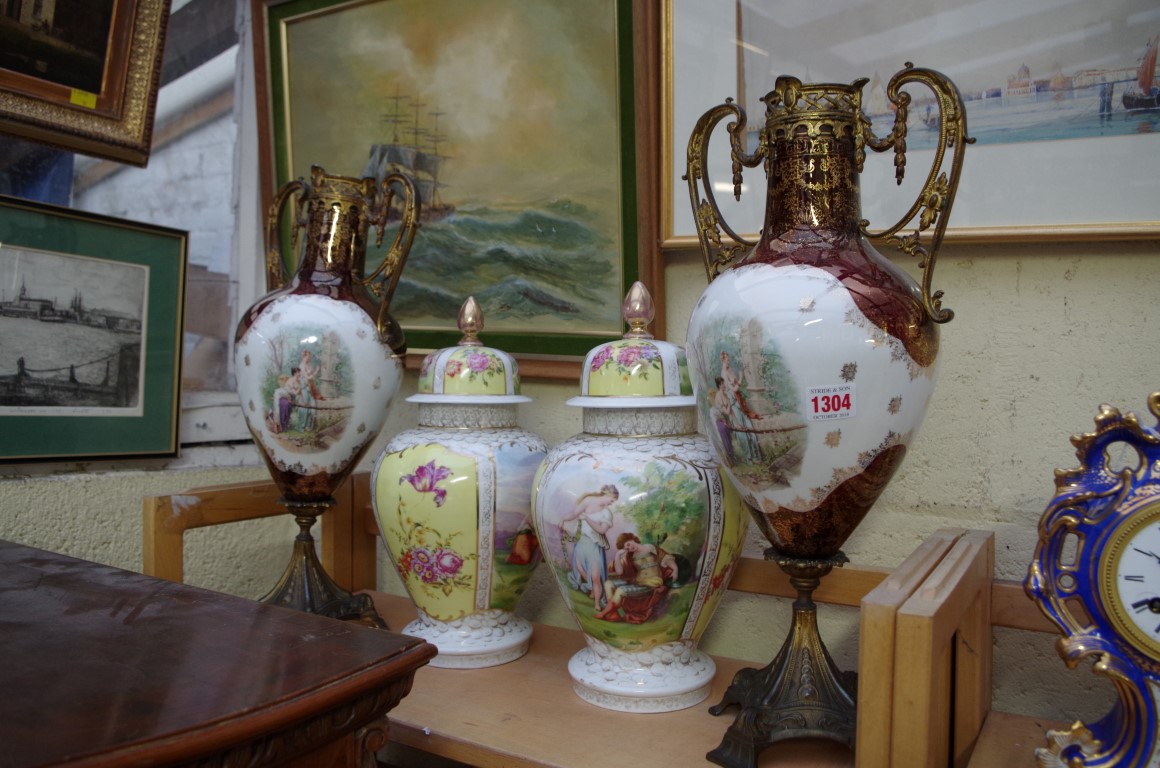 A pair of Plaue porcelain vases and covers, 34cm high, (both restored); together with another pair