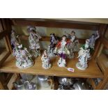 Nine Sitzendorf porcelain figures.