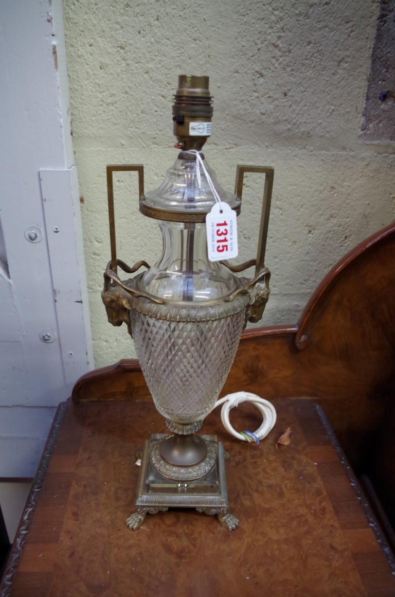 A brass and cut glass twin handled table lamp, in the Adam style, one foot stamped 'Made in Vienna'.