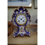 A late 19th century Continental porcelain mantel clock,  the enamel dial inscribed 'Potonie, Paris',