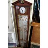A mahogany Admiral Fitzroy's barometer, incorporating a timepiece, by Comitti, 111cm high.
