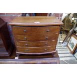 A miniature mahogany bowfront four drawer chest, 38cm wide.